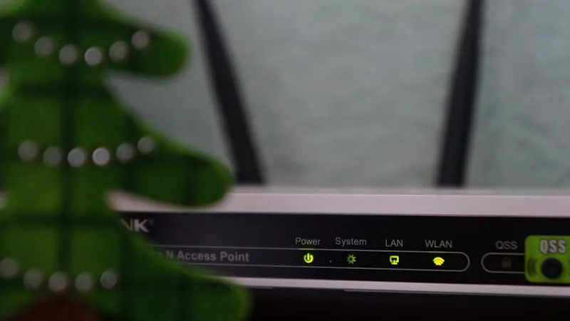 Wi-Fi router with status lights active on a home network